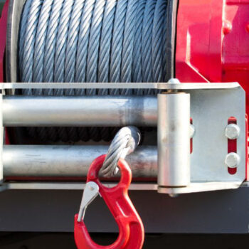 Winch attached to front of towing truck